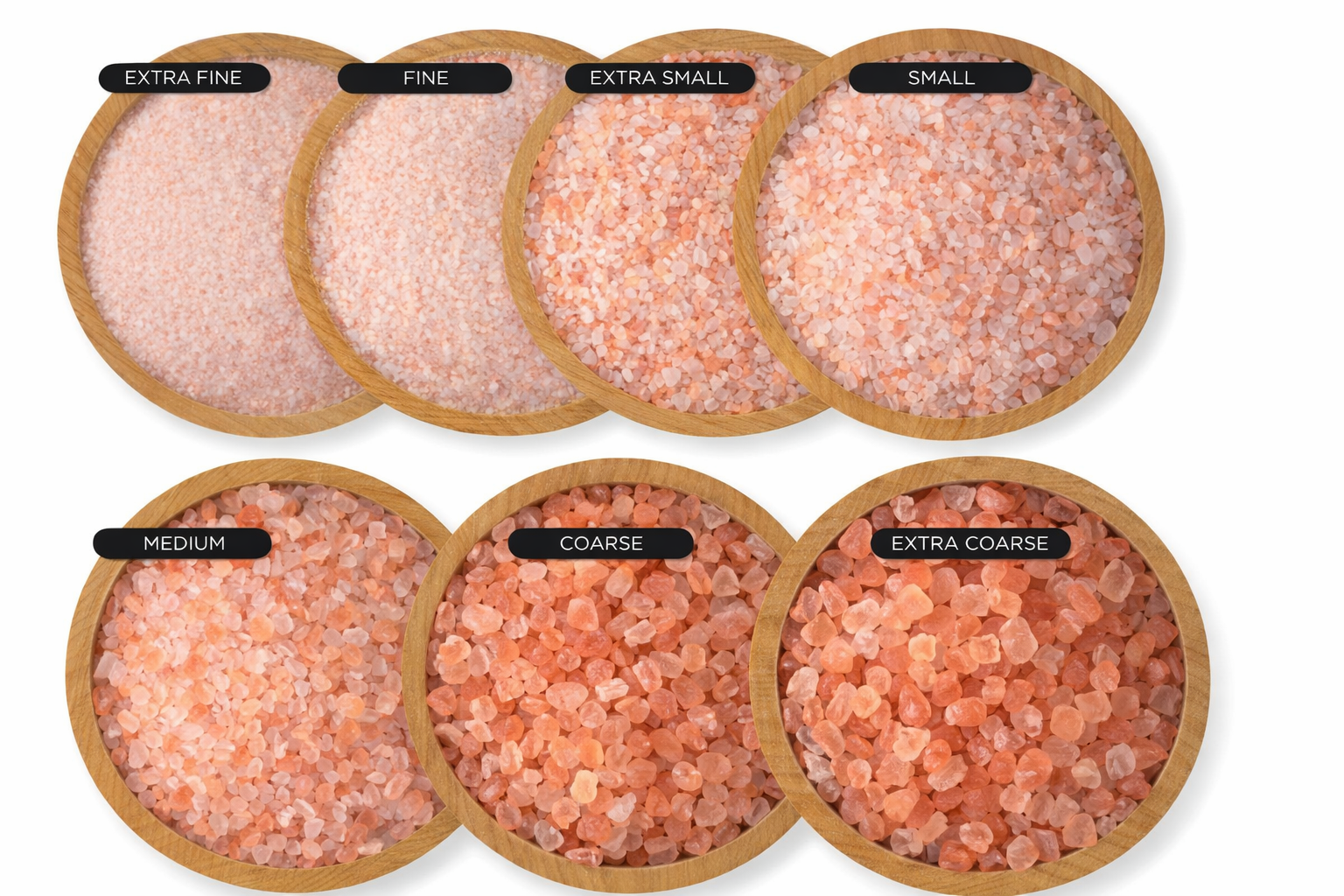 Pink mineral salt displayed in bamboo bowls showing grain sizes from extra fine to extra coarse